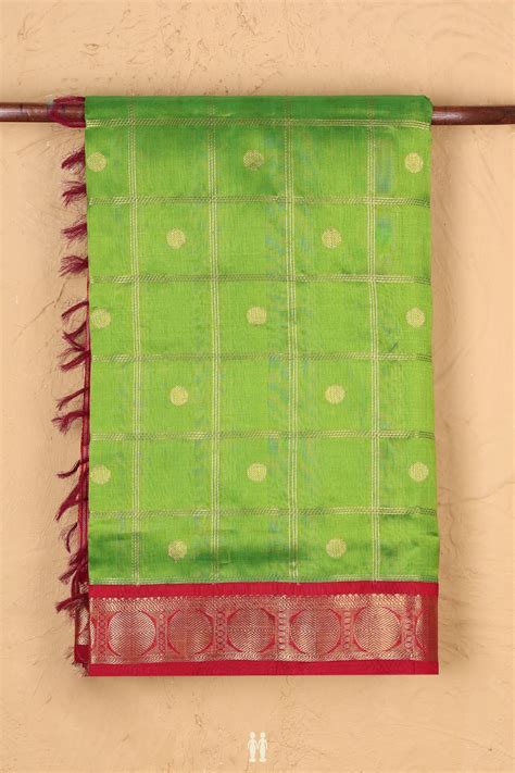 Traditional Silk Cotton Saree In Green Along Checks With Buttas