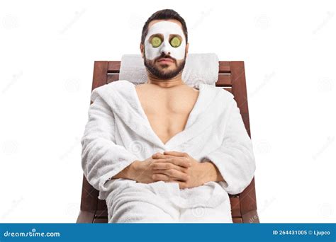 Man with a Face Mask and Cucumber Over Eyes Relaxing on a Lounge Chair ...