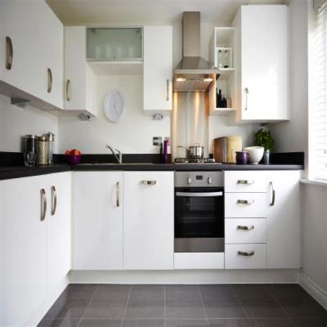 Contemporary L-Shaped Modular Kitchen Design With Pastel Green Cabinets