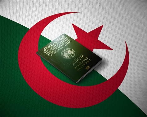 Algerian passport on the top of a algerian flag | Premium Photo