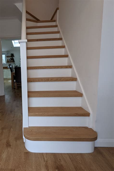 Engineered oak stair cladding with modern white painted risers uplifts ...