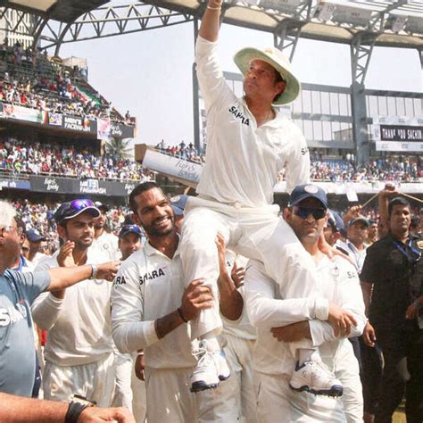 Sachin Tendulkar is given a farewell lap by his teammates as they carry ...
