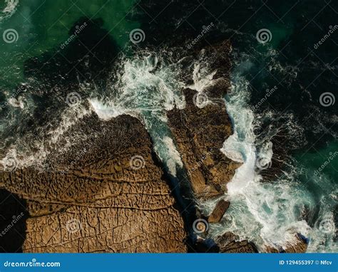 Aerial shots of the turquoise water, reef formations, beach and shipwreck at Henrietta Rocks.