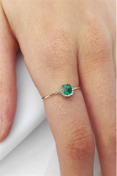 dainty emerald engagement ring