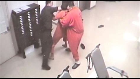 Surveillance video shows inmate helping detention officer who was ...