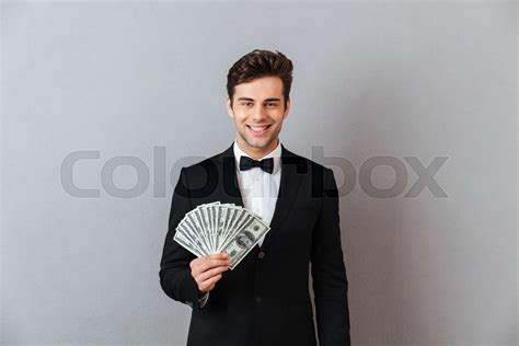 Guy Holding Money 的图像结果