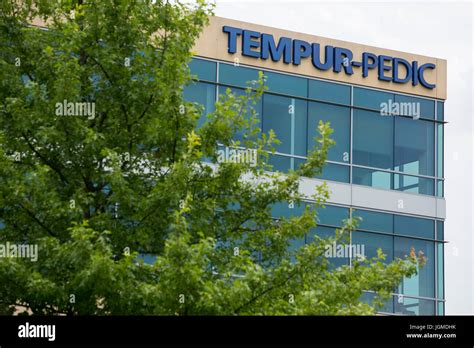 A logo sign outside of the headquarters of Tempur Sealy International ...