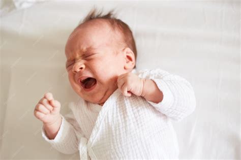 Premium Photo | Crying Newborn one month old baby boy Crying baby