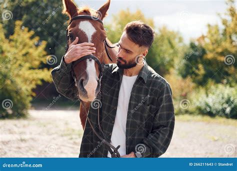 Front View. Young Man with a Horse is Outdoors Stock Image - Image of ...