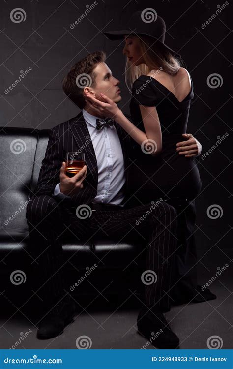 Rich Handsome Man Drinks Whiskey with a Blonde Mistress in the Evening ...