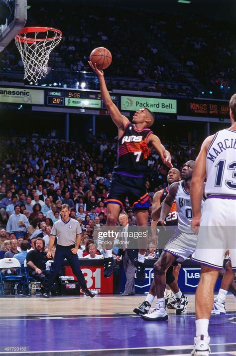 Kevin Johnson of the Phoenix Suns shoots against the Sacramento Kings ...