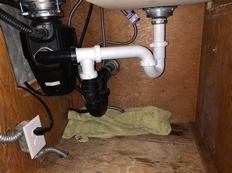 Two p-traps on a double basin sink w/ offset drains and a garbage ...
