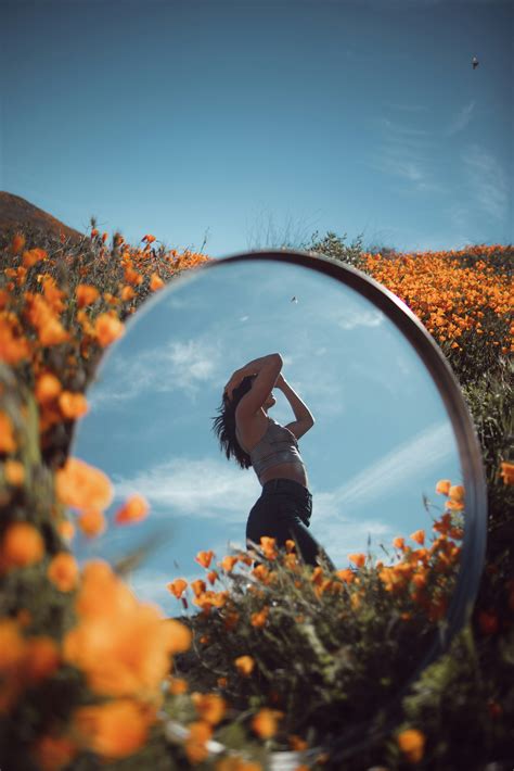 Reflective photo of woman on flower garden photo – Free Flowers Image on Unsplash