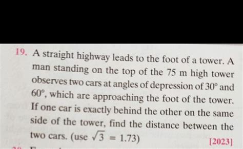 A straight highway leads to the foot of a tower. A man standing on the to..