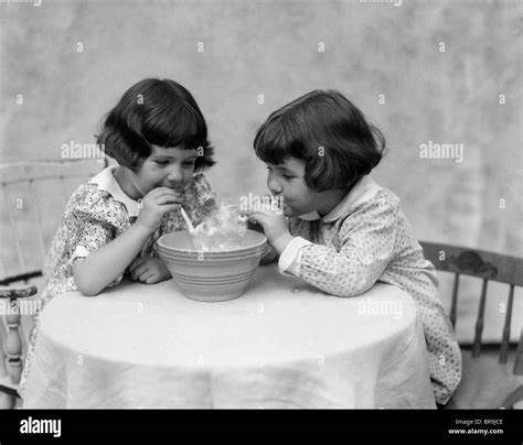 Girls blowing pipes Black and White Stock Photos & Images - Alamy