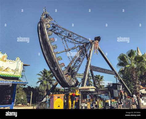amusement park in tropical country. a high swing for tourists to ride ...