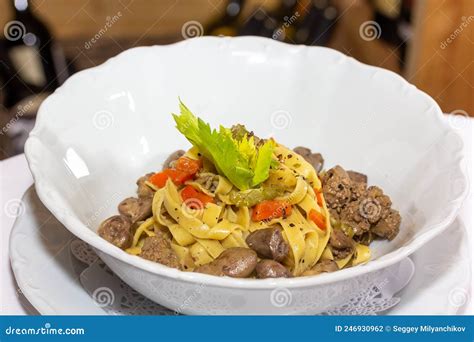 Italian Linguini Pasta with Chicken Hearts and Herbs Stock Photo ...