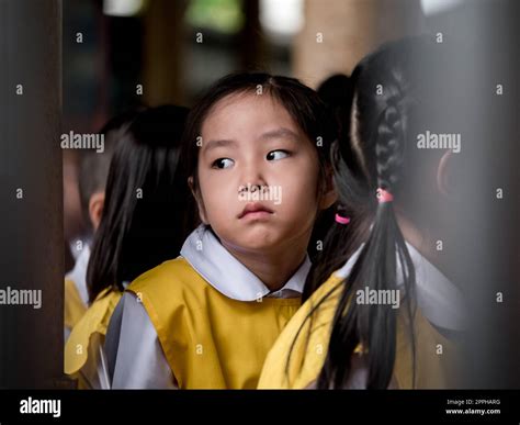 The little Asian girl feeling sad when she go to school Stock Photo - Alamy