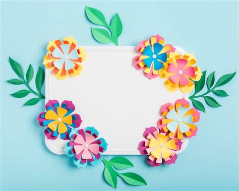 Assortment of multicolored paper spring flowers on whiteboard | Free Photo