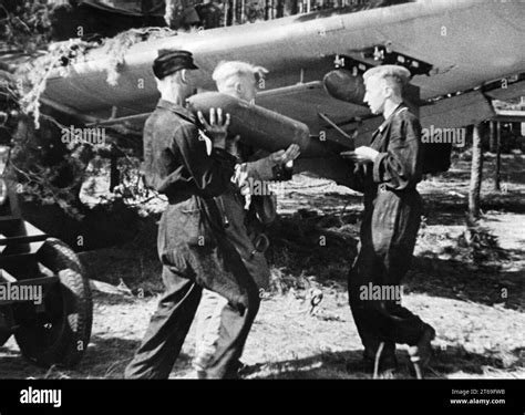 German Messerschmitt Me 110 is loaded with aerial bombs on the Eastern ...