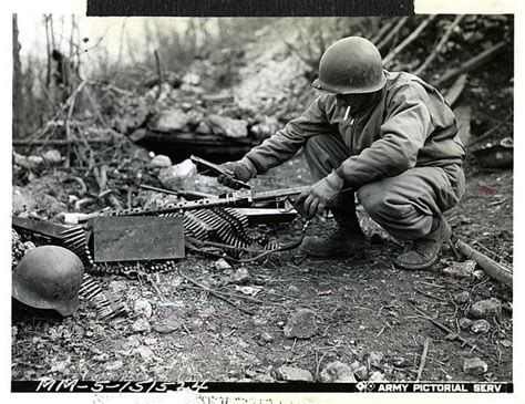 Italy! An American infantryman examines a captured German light machine ...