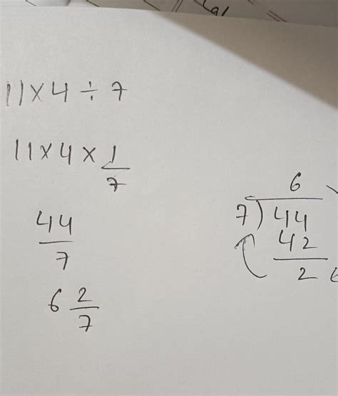 [tex]11 \times 4 \div 7[/tex]Multiply and reduce to lowest form and ...