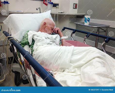 Elderly Male Hospital Patient In Hospital Bed Stock Photo - Image: 58237297