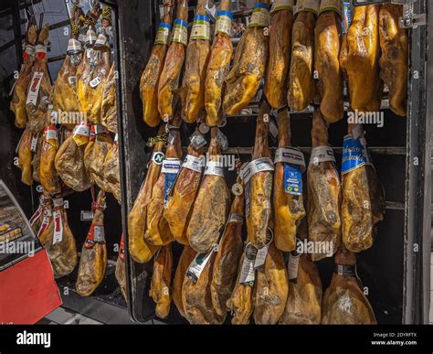 Hanging pig legs in market hi-res stock photography and images - Alamy