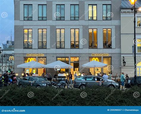 WARSAW, POLAND - JULY 15, 2022: Exterior of Building with McDonald`s ...