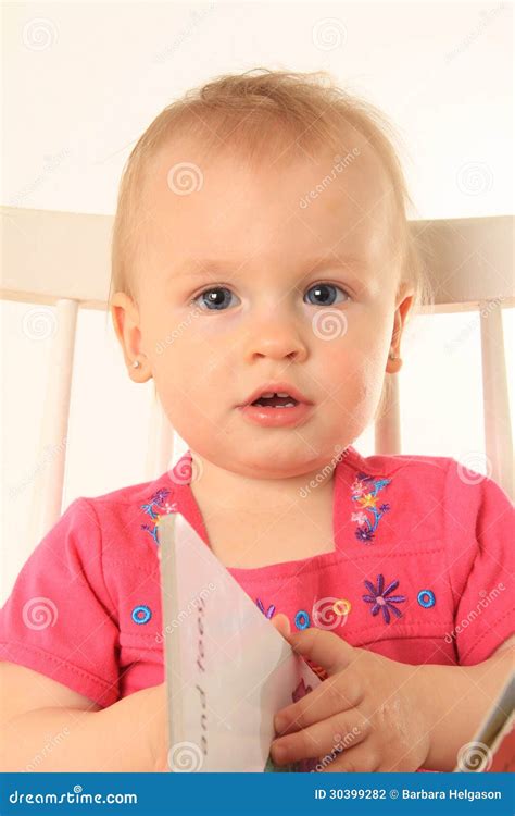 Baby girl and book stock photo. Image of reading, year - 30399282