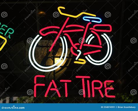 Bright Colours Neon Sign Promoting Fat Tire Beer in Window at Night ...