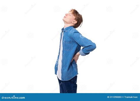 Young Handsome Red-haired Guy in a Blue Shirt Sips His Back Stock Image ...
