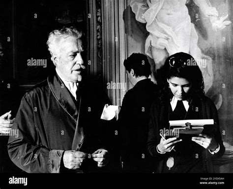 VITTORIO DE SICA on set candid going over his lines with Script Girl ...