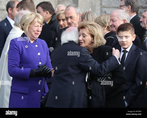 President Michael D Higgins comforts Maruja Sutherland, widow of former ...