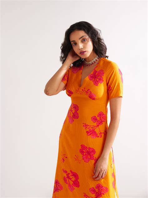 Gulmohar back tie-up kurta Paired with side pleated dhoti- Spicy Orang