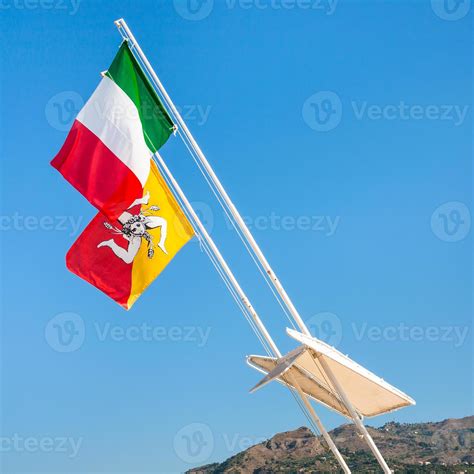 Italian and Sicilian flags and blue sky 11688473 Stock Photo at Vecteezy