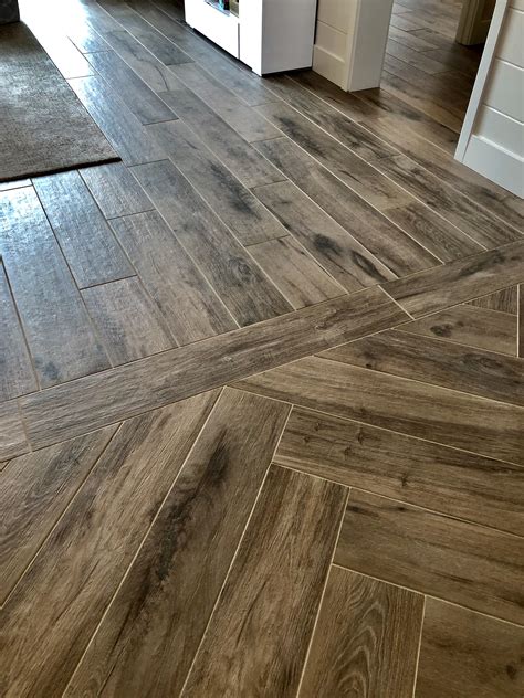 Wood Look Tile Floor in Kitchen with White Cabinets
