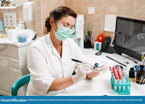 Laboratory Assistant Holds Test Tubes for Gynecological and Cytological Analysis. Woman ...
