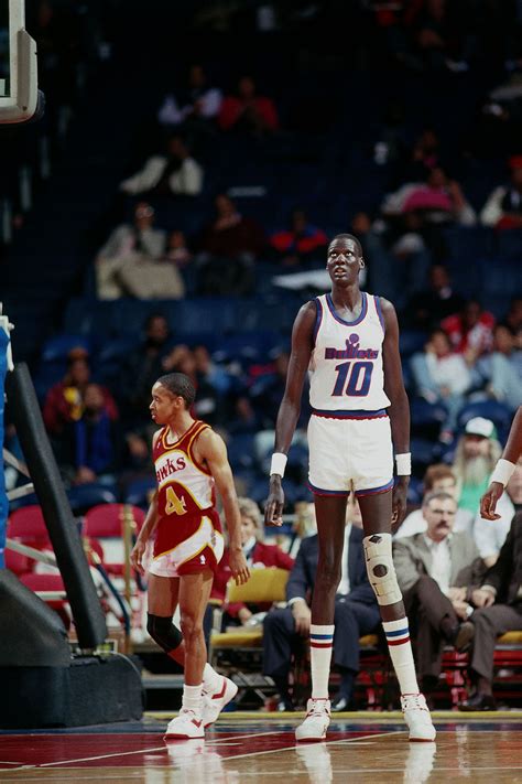 The "long" and "short" of it...Manute Bol (7' 7") and Spuds Webb (5' 7 ...