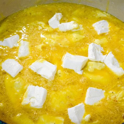 Pour the scrambled eggs into the pan and cover and let cook on low heat ...