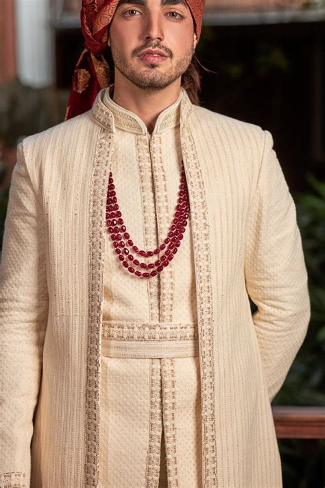 Cream sherwani in lucknowi with sequence and resham work