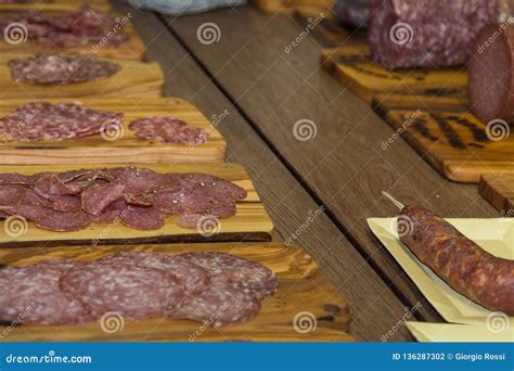 Various Types of Italian Sliced Salami on Wooden Chopping Boards Stock ...