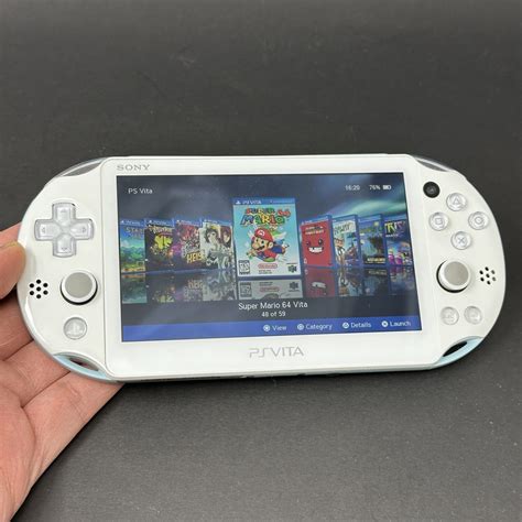 PS Vita Slim (128GB) – 580 Games | White and Blue – Samtendo