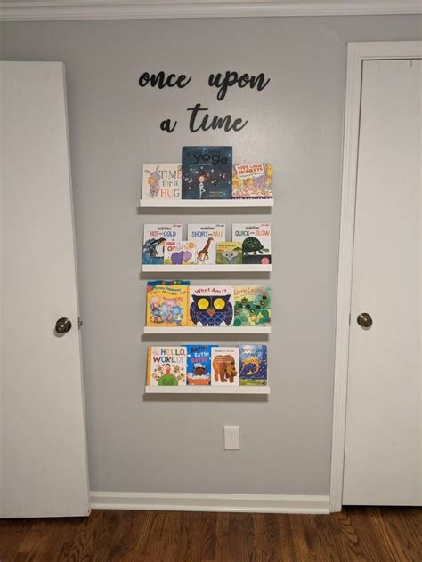 IKEA picture frame ledges as book shelf displays in our nursery in 2021 | Ikea picture frame ...