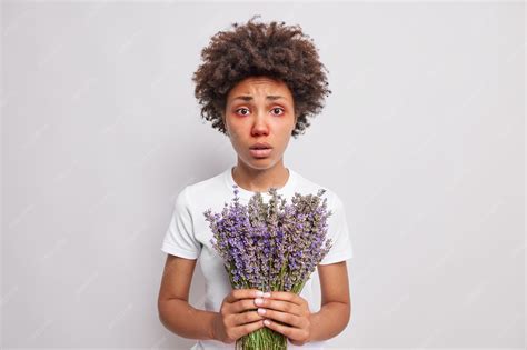 Premium Photo | Woman with red eyes holds lavender bouquet has allergy ...