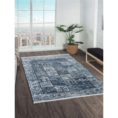 Buy OBSESSIONS Blue Solid Machine Made Rectangular Carpet Online