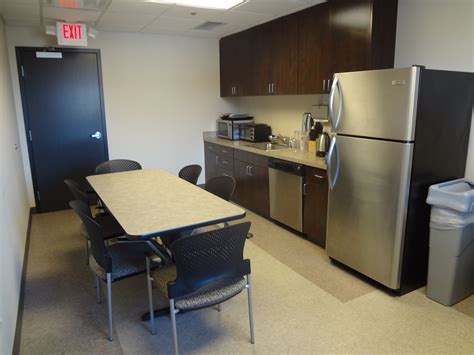 Employee break room with custom cabinetry and vct flooring | Office ...