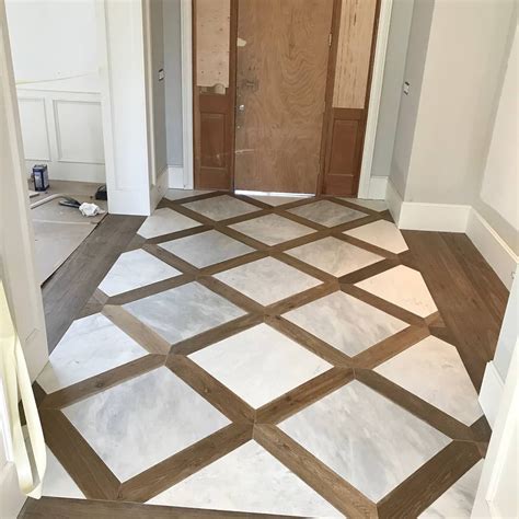 This foyer is turning out great...custom wood and tile inlay. Wood ...