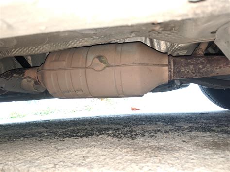 Car muffler making loud noise from this damaged part, how is it called? : r/CarRepair