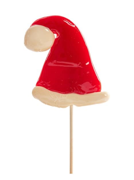 Santa claus hat lollipop isolated on white background | Premium Photo